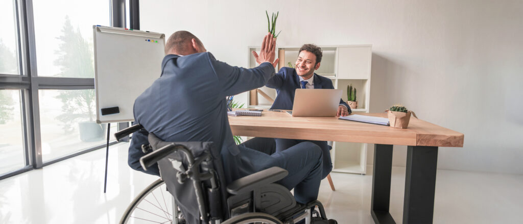 sad young woman sitting on wheelchair in room